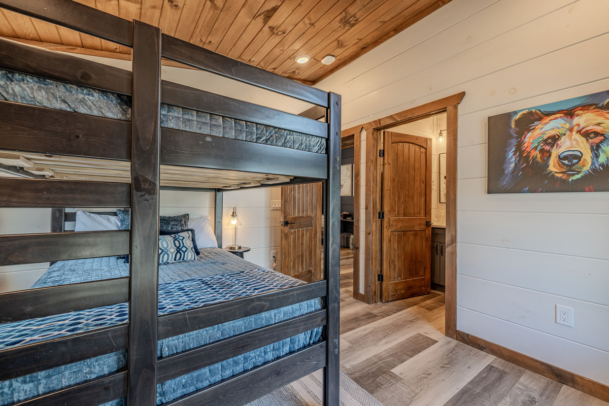 Across the hall from the upstairs King Master, this bunk room has it's own full size bathroom.