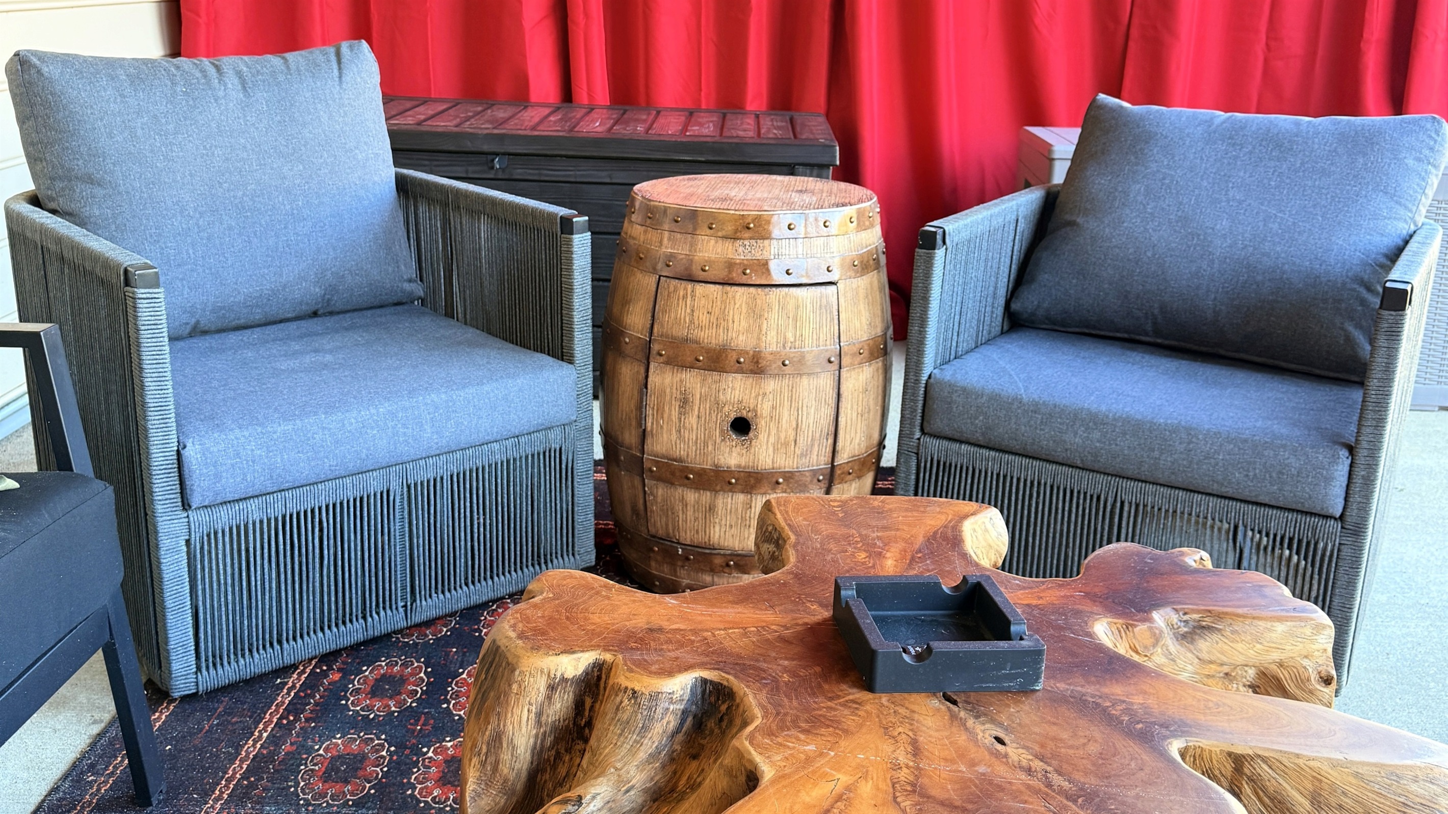 A quiet corner for conversation — rich wood, bourbon-barrel charm, and a hint of old-world leisure invite guests to slow down and savor the moment.