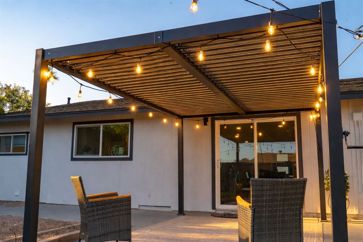 From sun to sunset—covered patio with bistro lights offers the perfect space to relax, dine, and gather in Scottsdale