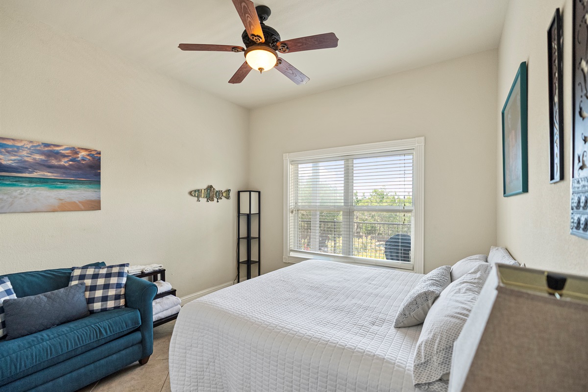 King bed located just off the game room. Quiet, private, and perfect for a restful stay.