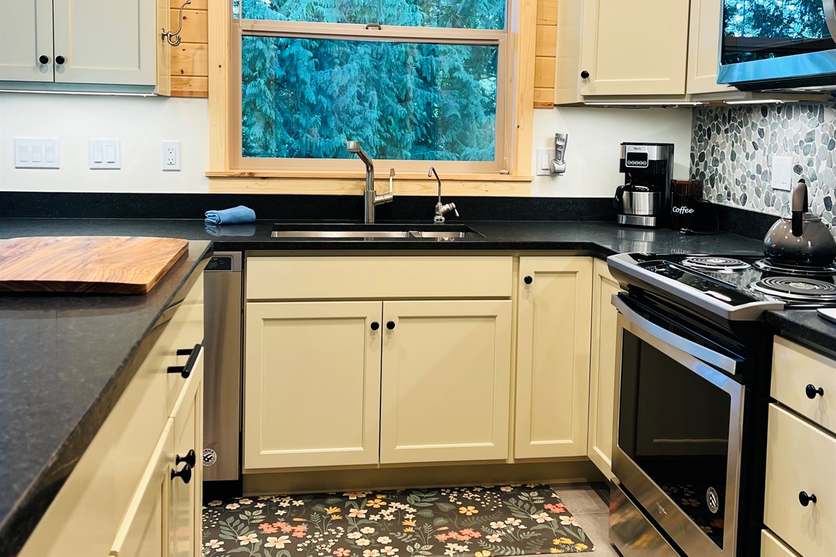 Kitchen is spacious and offers plenty of counter space for preparing meals.