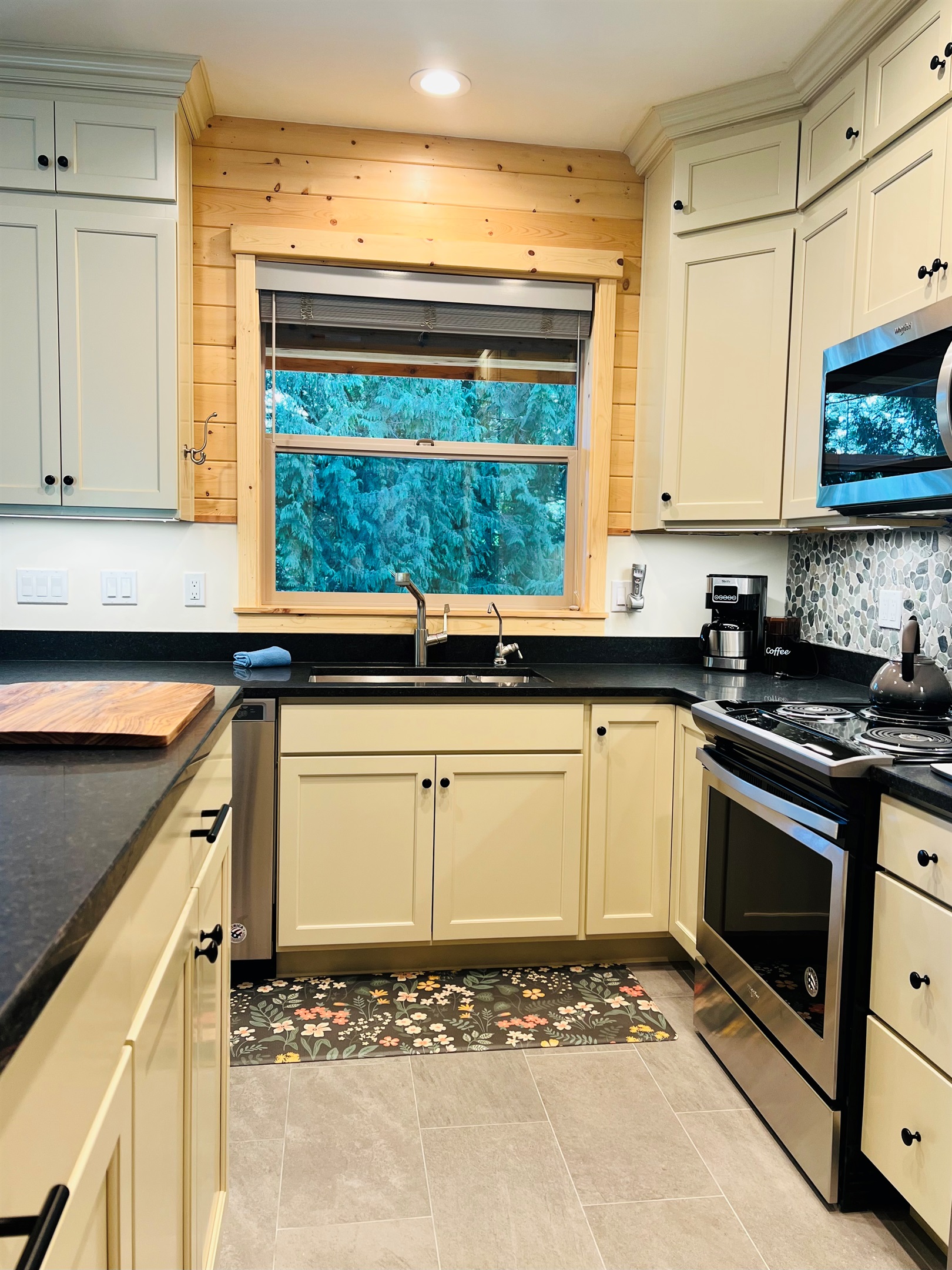 Kitchen is spacious and offers plenty of counter space for preparing meals.