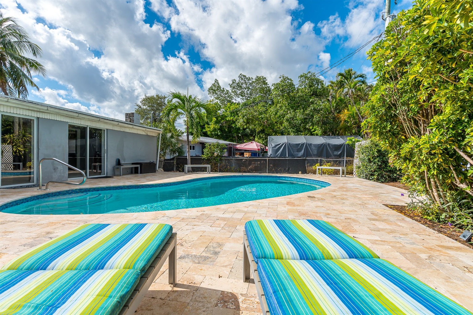 The outside is a highlight, with the heated pool, outdoor sun- loungers, BBQ and covered dining area.