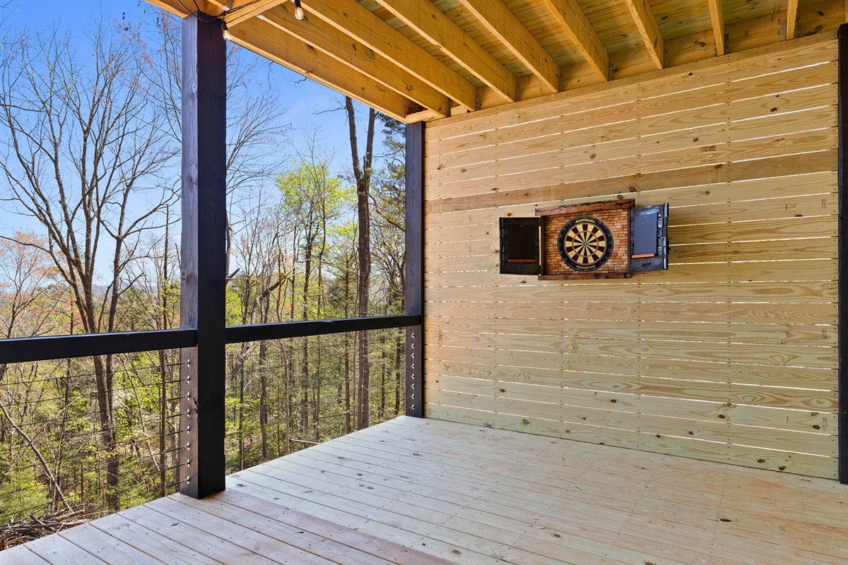 Outdoor custom dart area for more fun when you play against a backdrop of forest and sky.