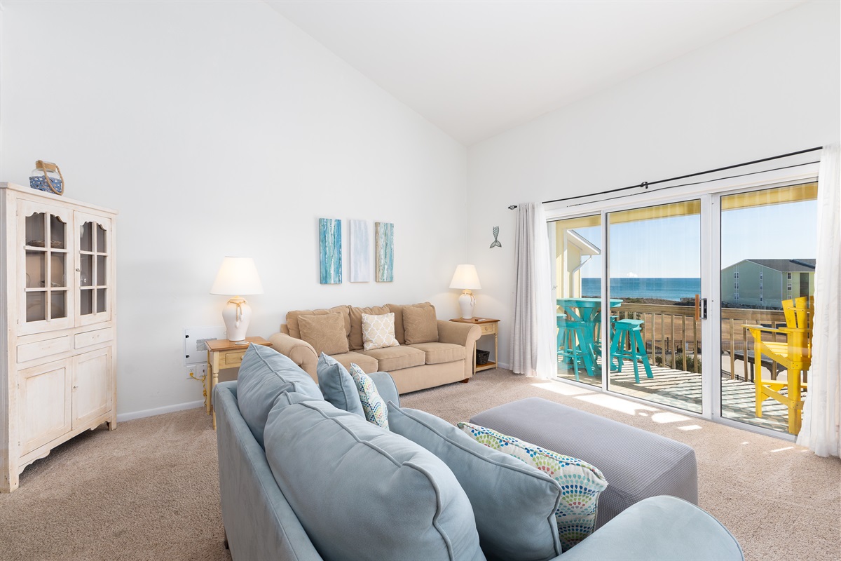 The living room features a Queen-size sofa bed 