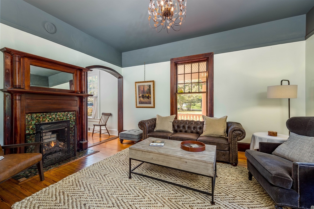 The parlor is a fine space to gather comfortably with firelogs for ambiance