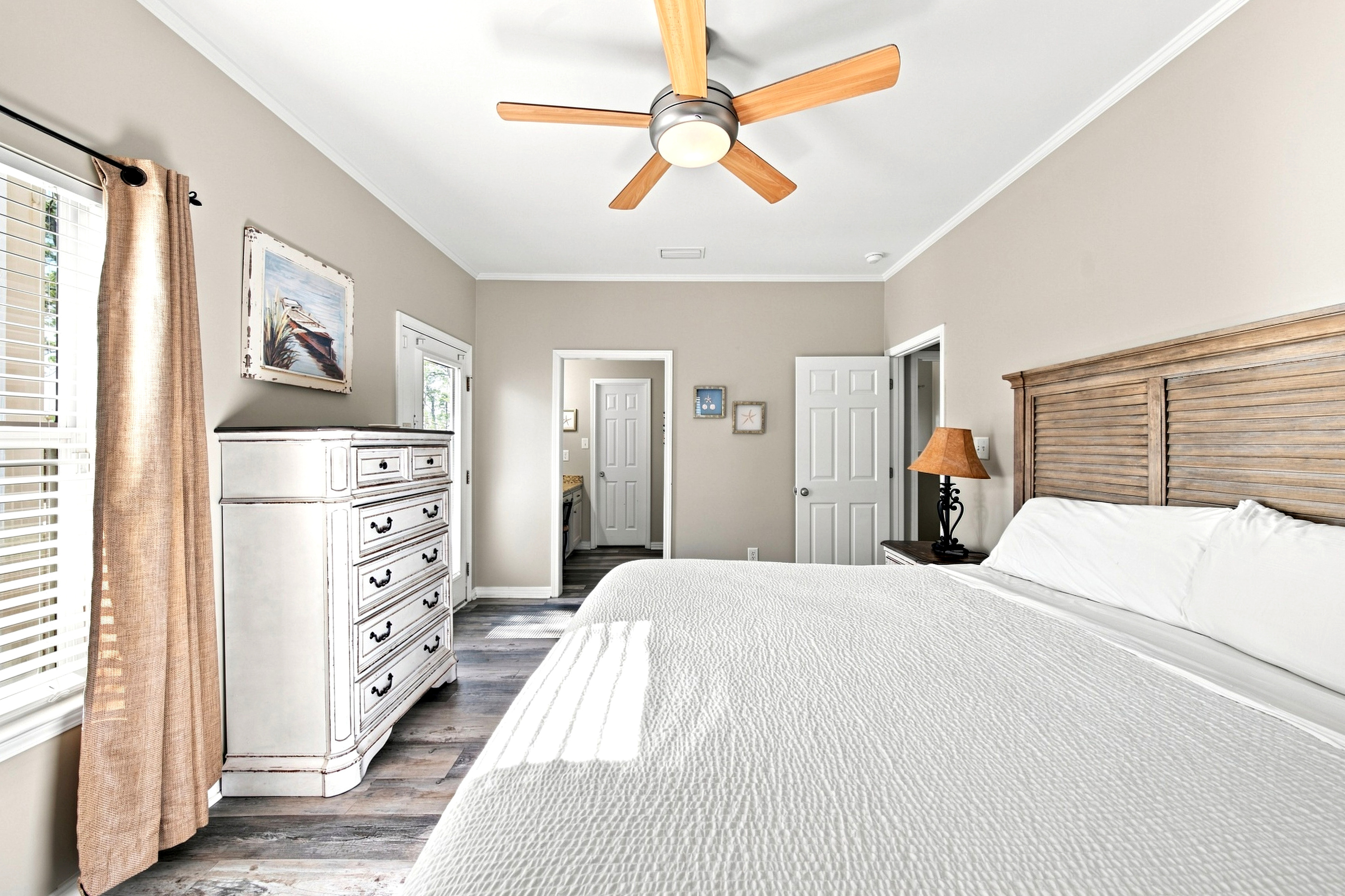 A second guest bedroom offers cozy, coastal-cottage furnishings and plenty of closet space.