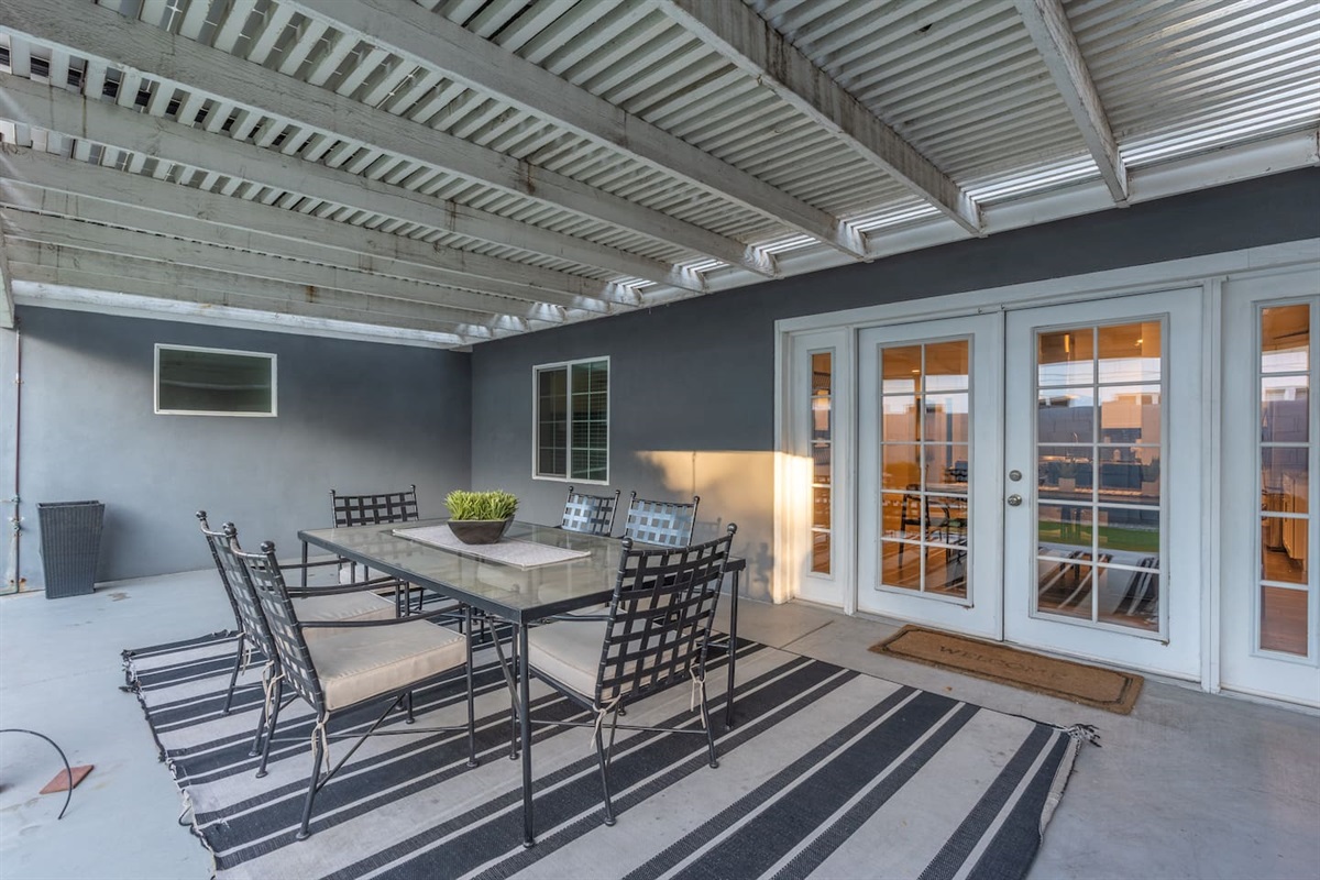 Inviting backyard with a dining area, perfect for enjoying meals outdoors in a relaxed and serene environment.