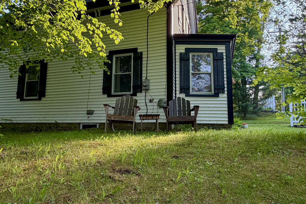 Take in the elevated views from classic Adirondack chairs nestled in the side yard. This peaceful, shaded hilltop vantage point is the perfect outdoor spot to reflect on your day or enjoy a quiet, sunny afternoon on MDI.