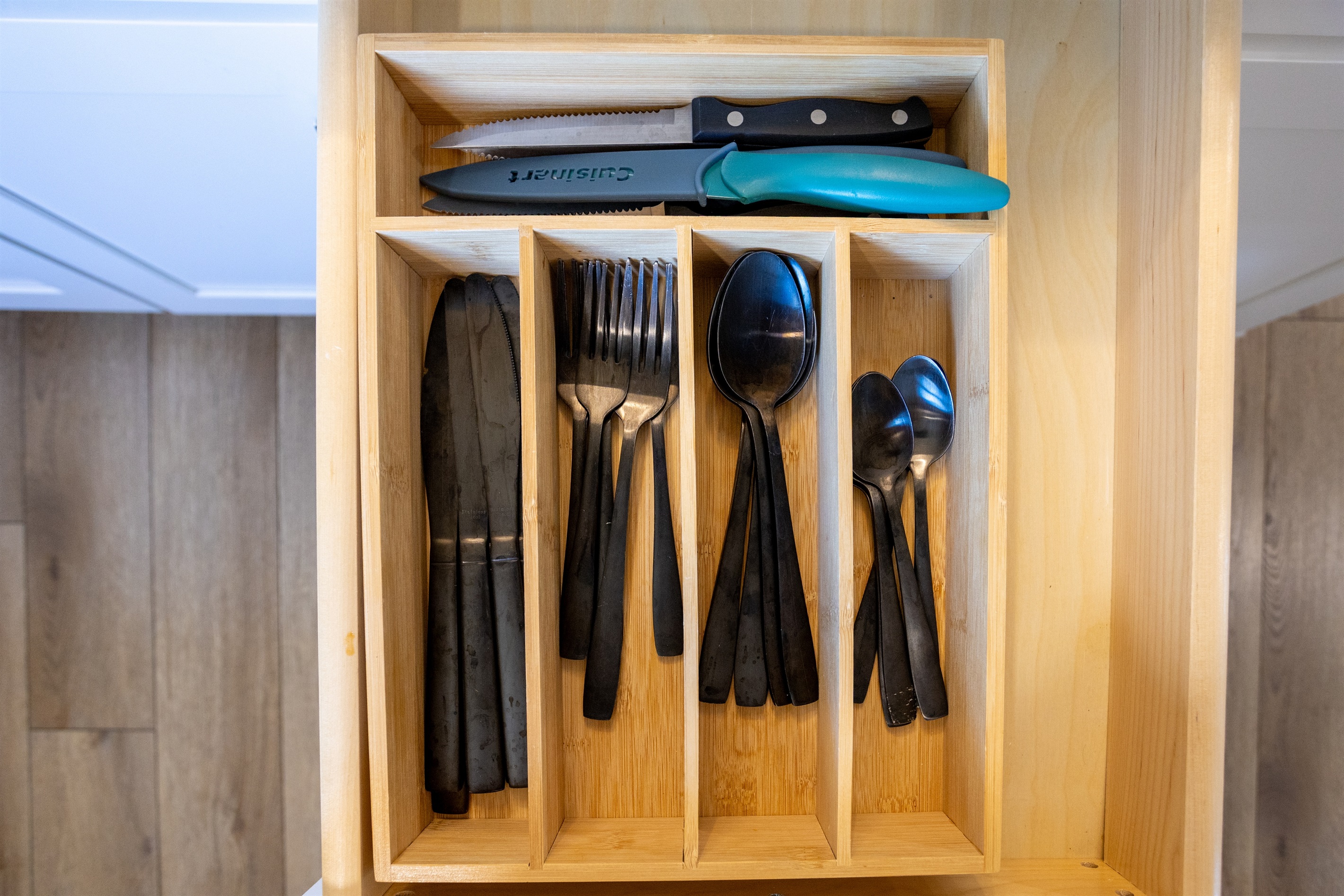 Find every utensil you need neatly organized and ready for your next meal.