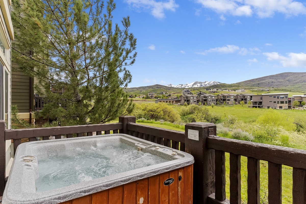 Private hot tub with breathtaking mountain views—your perfect spot to unwind and soak in the scenery.