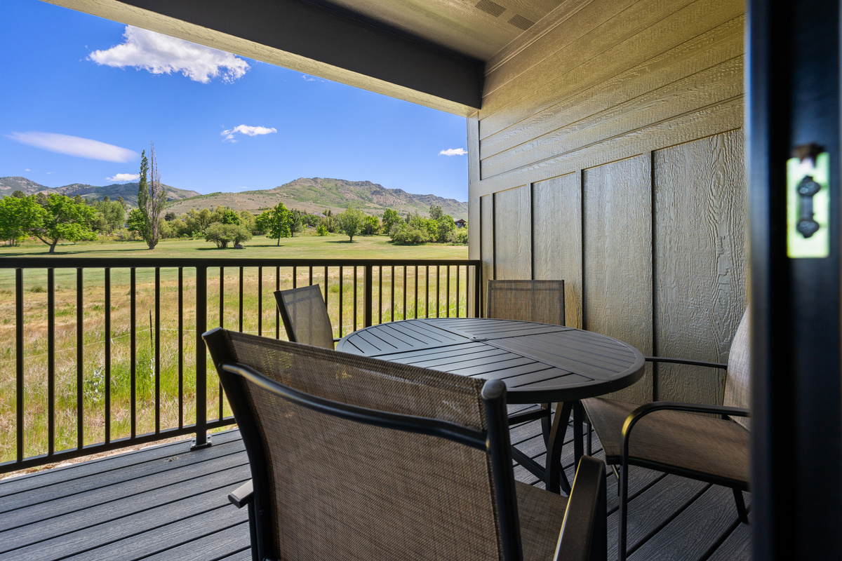 Enjoy outdoor dining with peaceful fairway and mountain views.