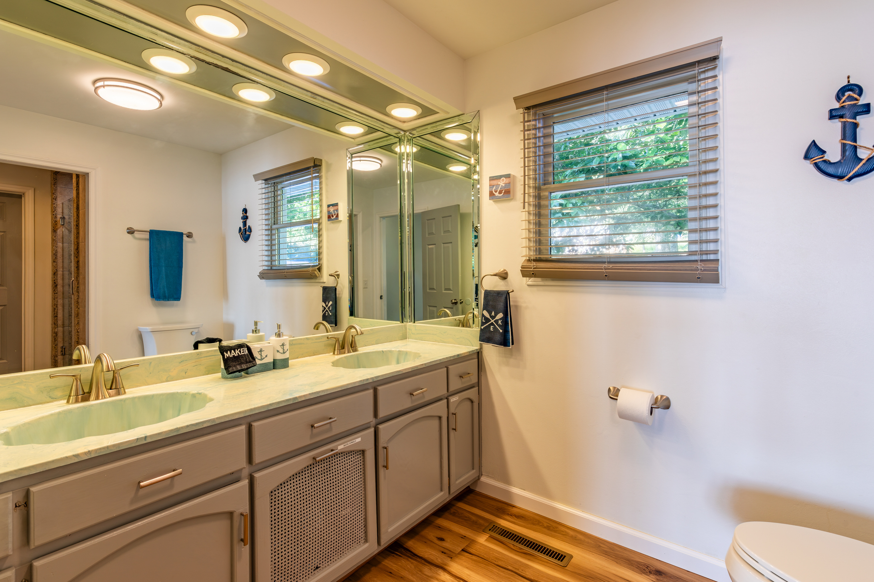 The upstairs common bathroom includes a long double-sink vanity, giving multiple guests room to get ready.