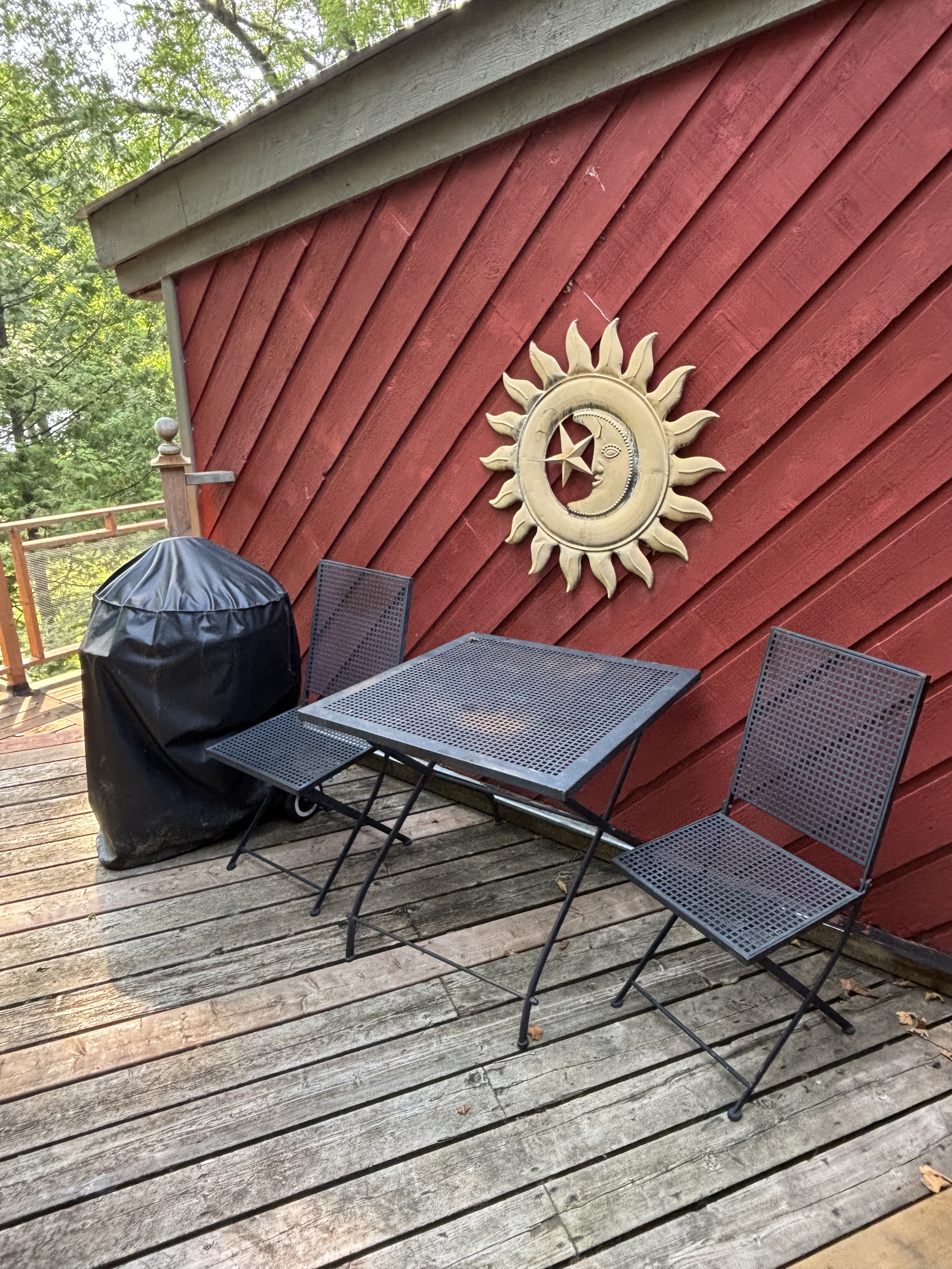 Deck at back of cottage with BBQ