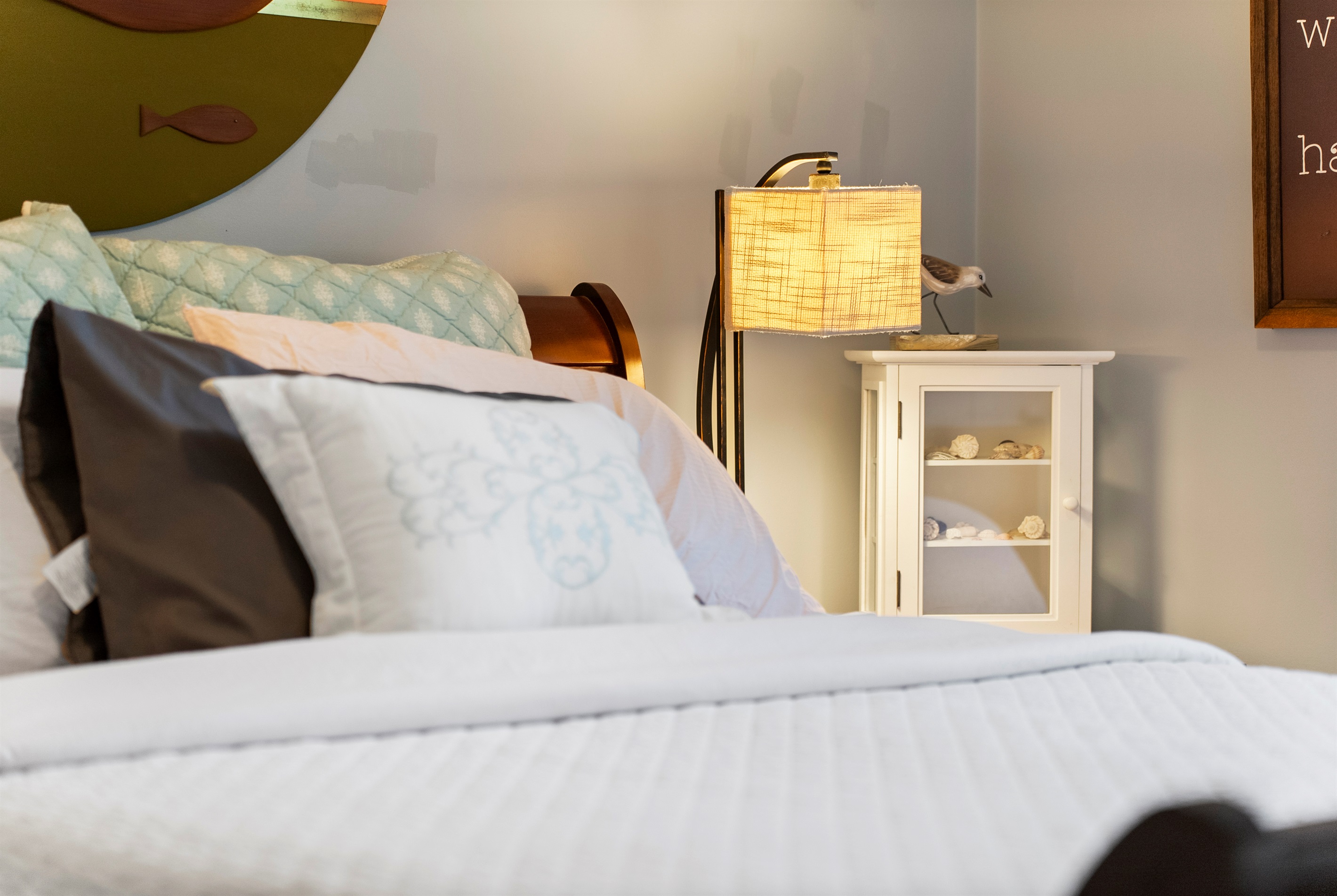 Queen room with ocean themed decor.