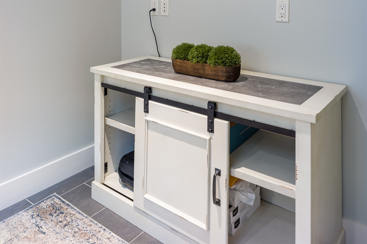 Credenza located inside office compete with printer and paper for your use.