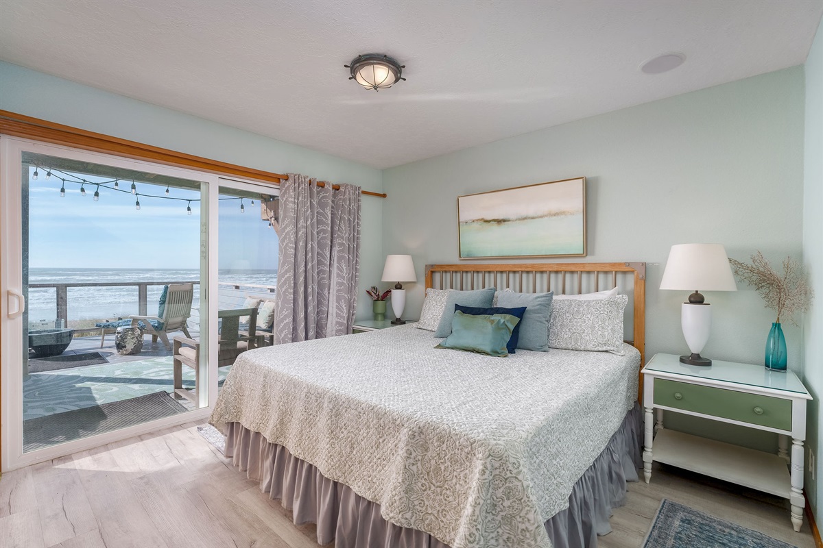 Experience the tranquility of seaside living with a king size bed for your comfort. Not pictured is a twin bed in the same room.