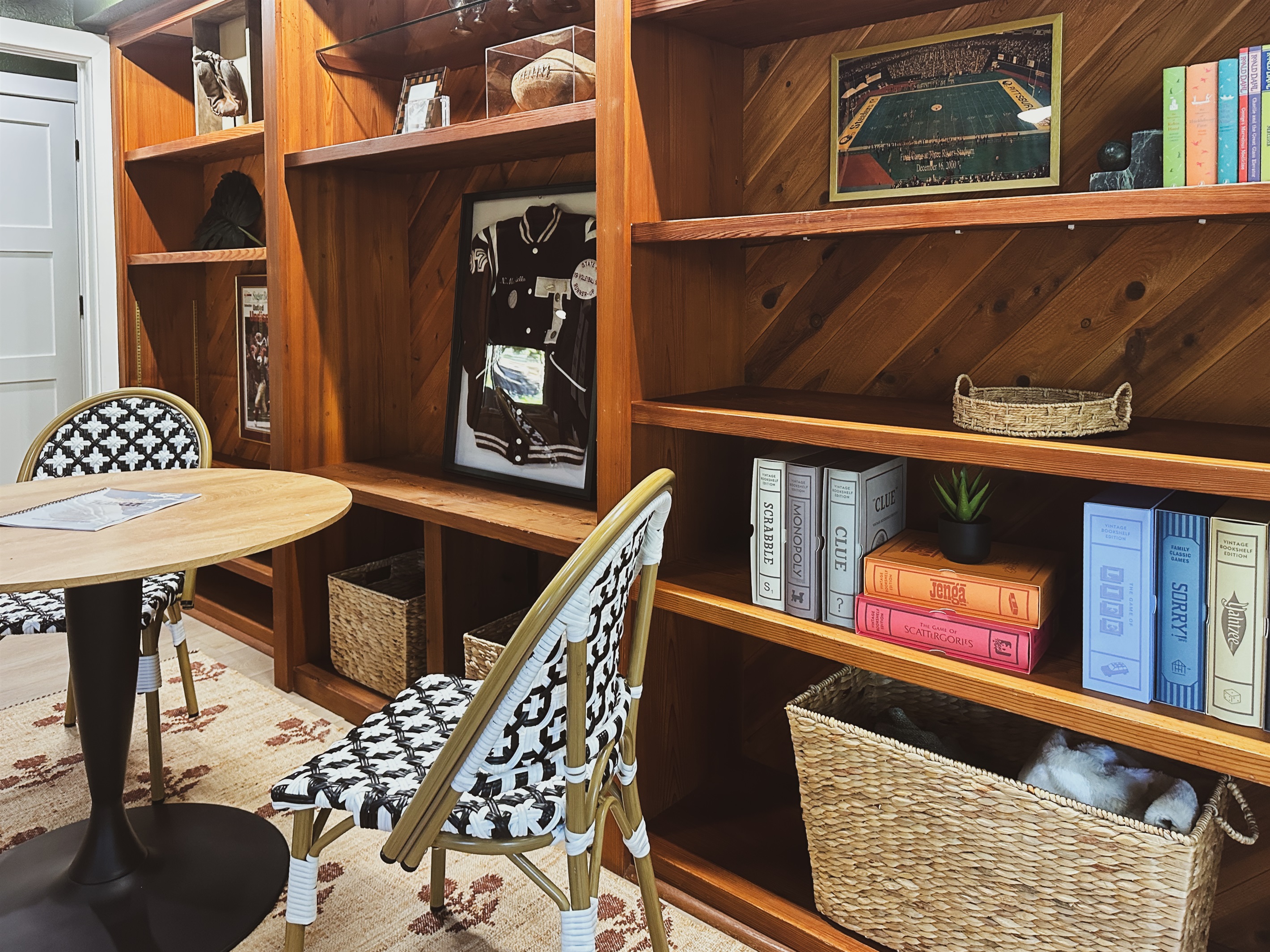 Trophy shelf contains plenty of Vintage board games, a poker set and multiple card and family game options in the baskets for all ages.