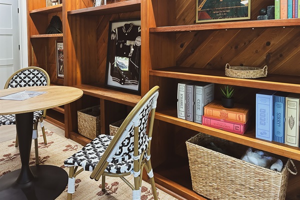 Trophy shelf contains plenty of Vintage board games, a poker set and multiple card and family game options in the baskets for all ages.