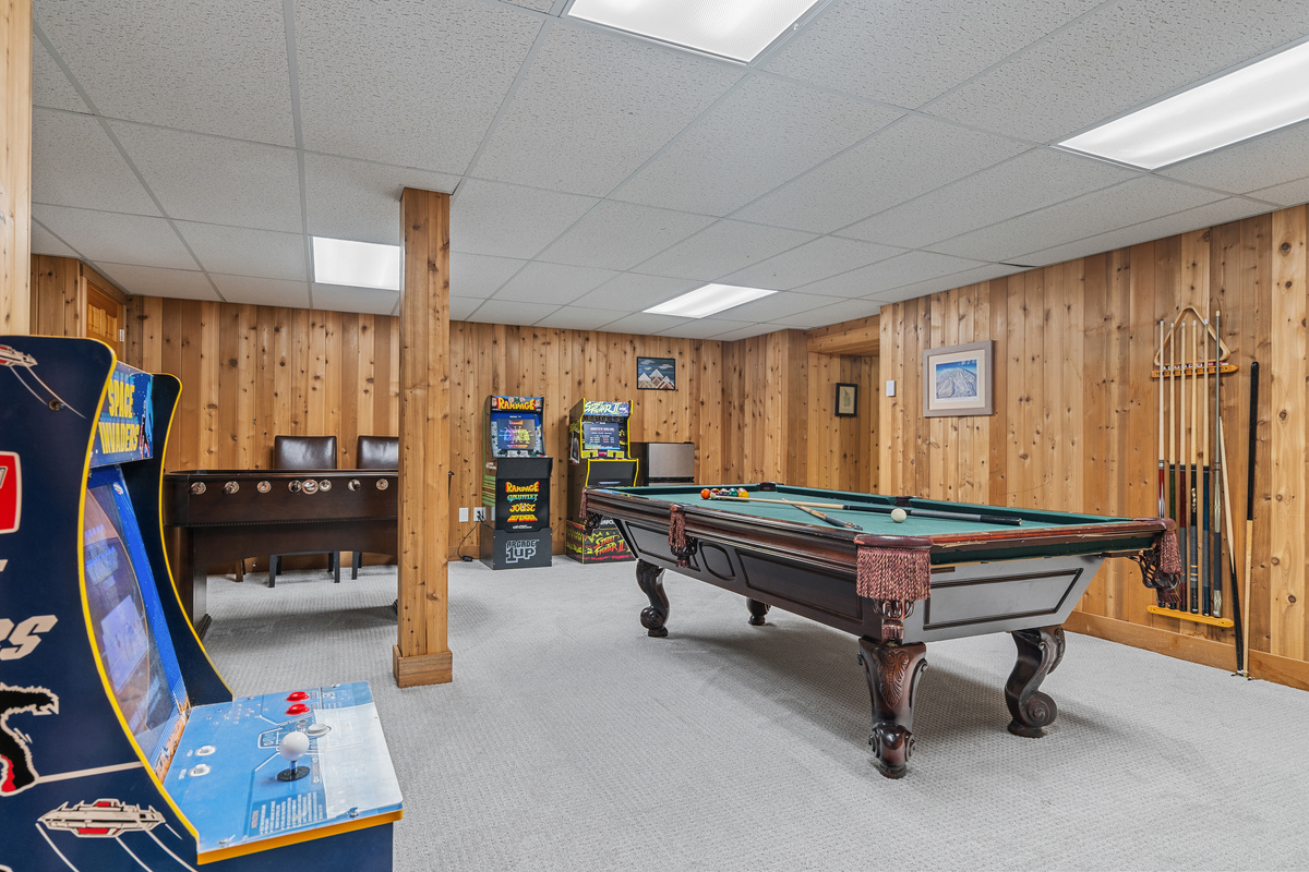 Arcade machines, billiards and foosball fill the game room of this Stratton Mountain ski house