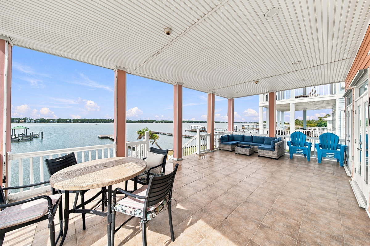 Waterfront porch with room to dine and lounge above the water