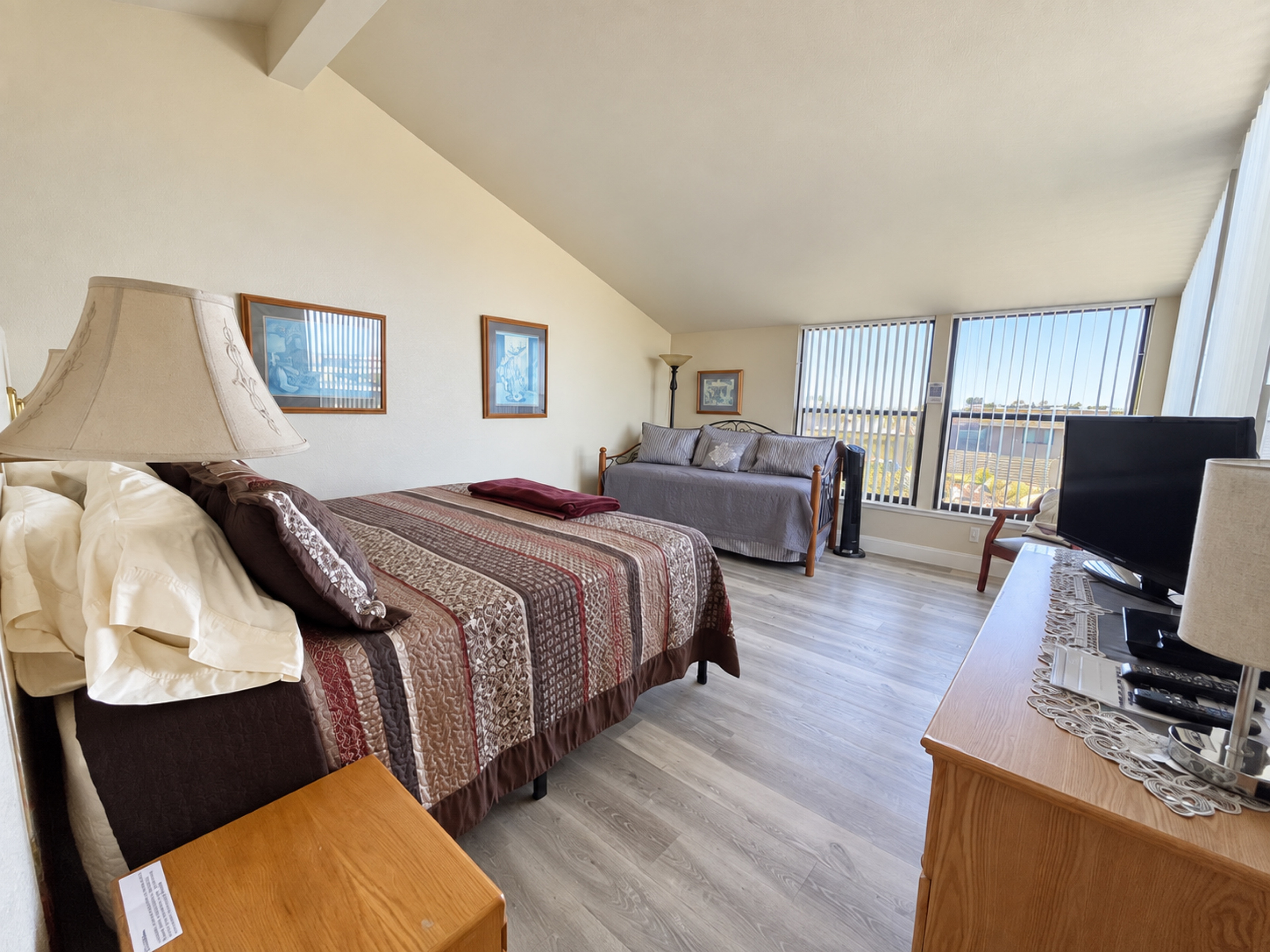 Front Master Suite with King bed and trundle (2-twins). Vaulted ceilings, 4 large picture windows adds lots of natural light.