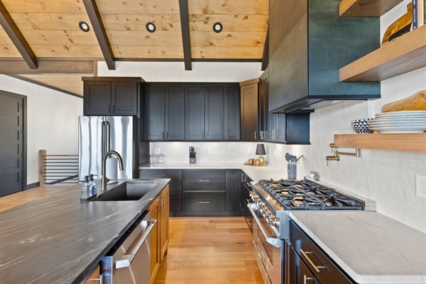 Dark cabinets and bright counters create a space that is both inviting and efficient.