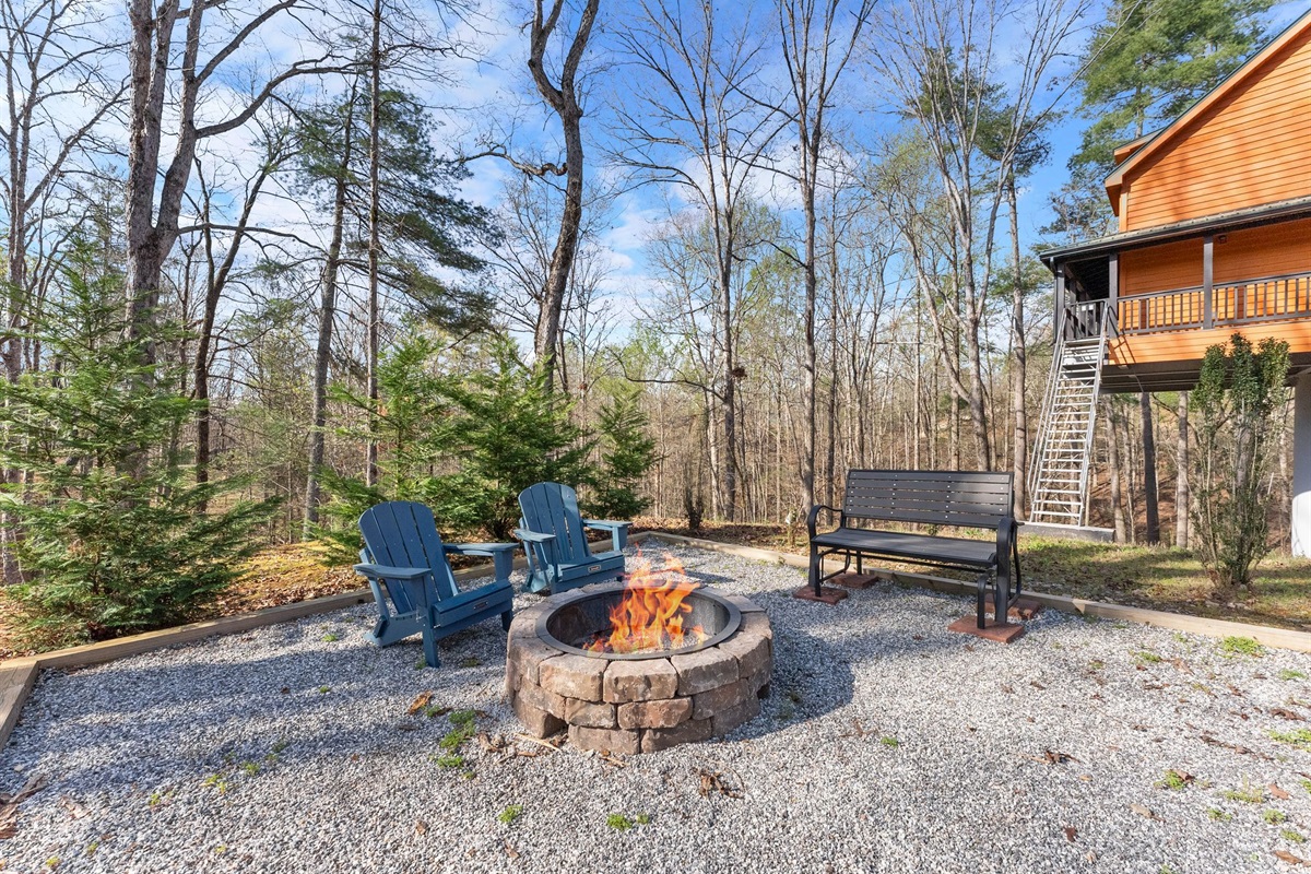 Chill by the Crackling Fire Pit with Adirondack Chairs, surrounded by Towering Trees