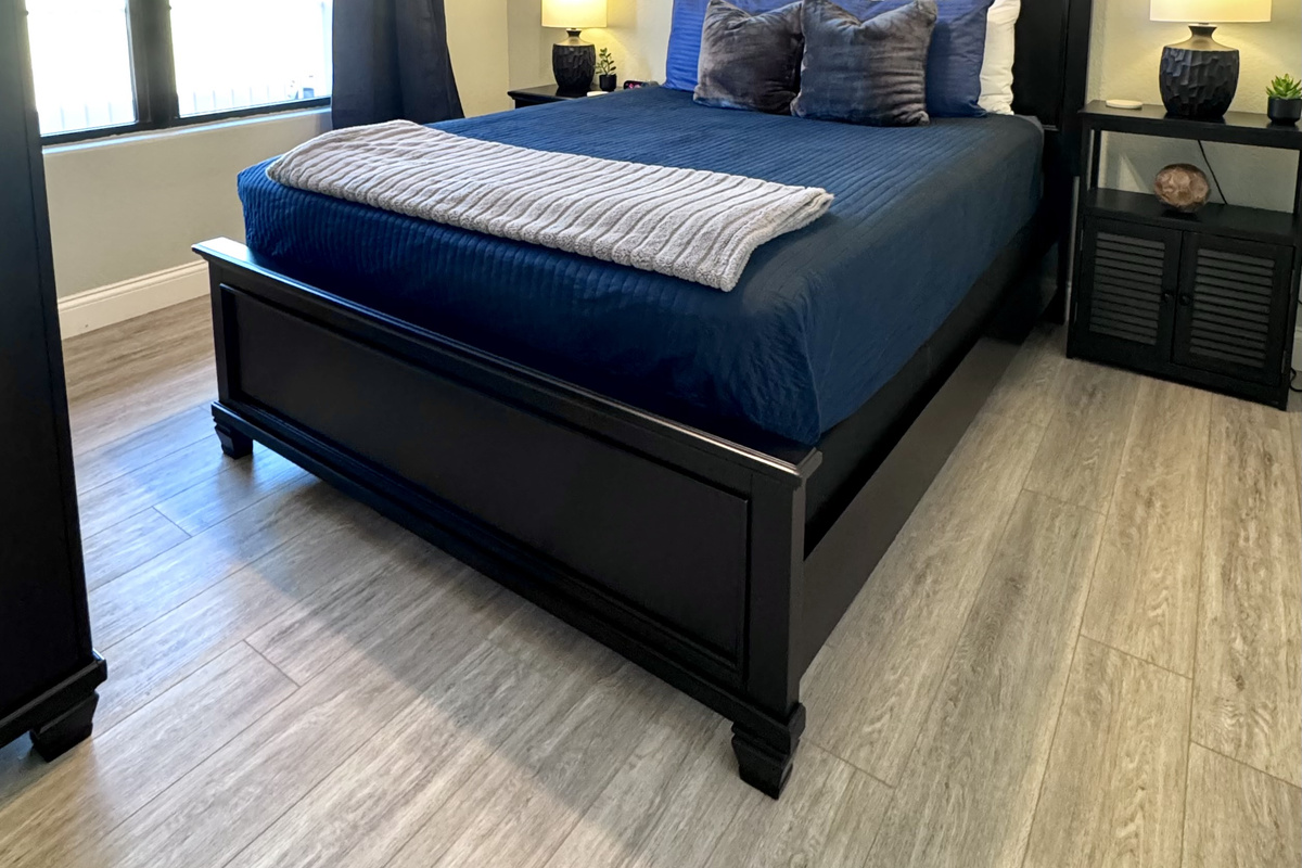 Bedroom 2 has a queen bed with Roku TV, two nightstands, lamps, dresser, closet, all bed linens, extra pillows, blanket, extra set of sheets, and an alarm clock.