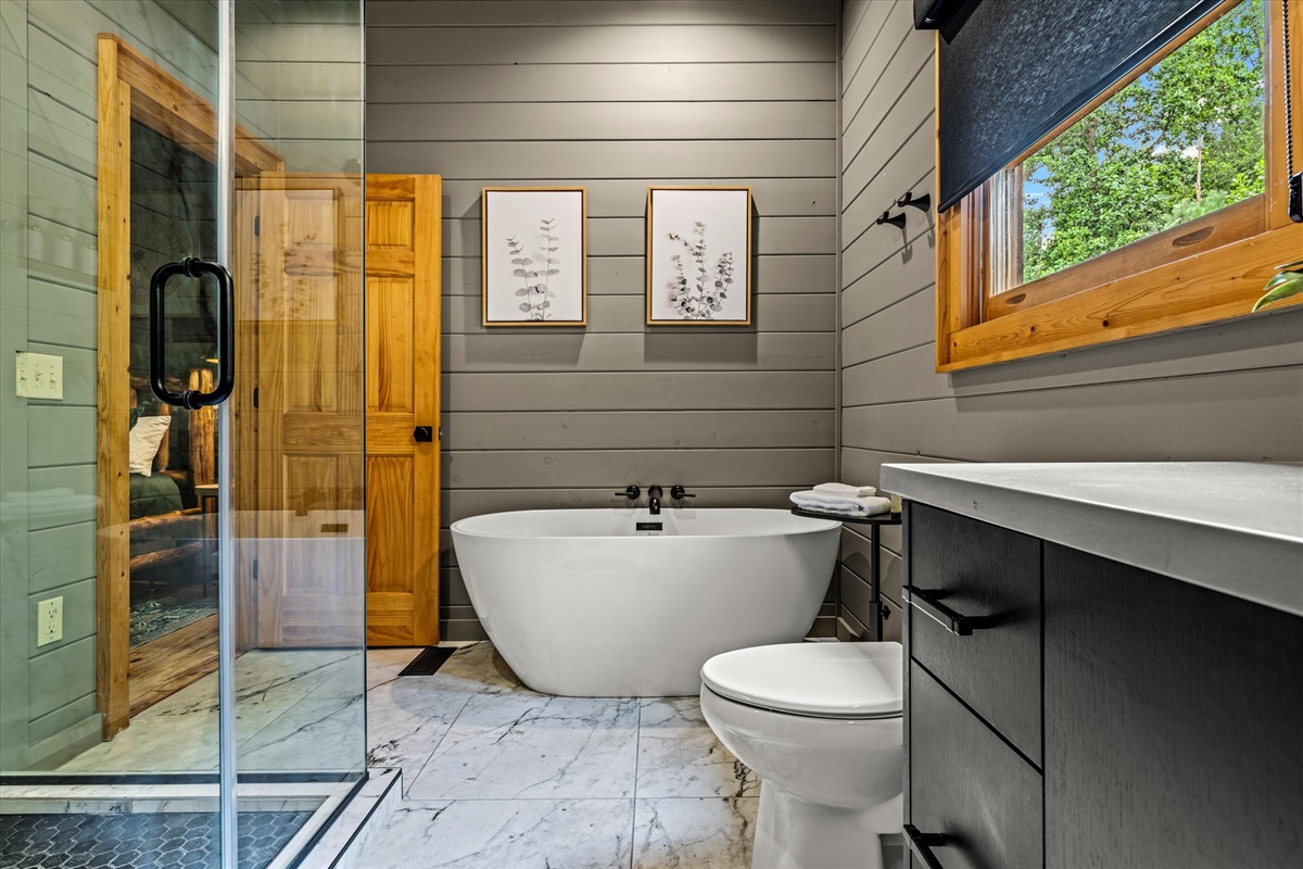 En-suite bathroom with tub and shower