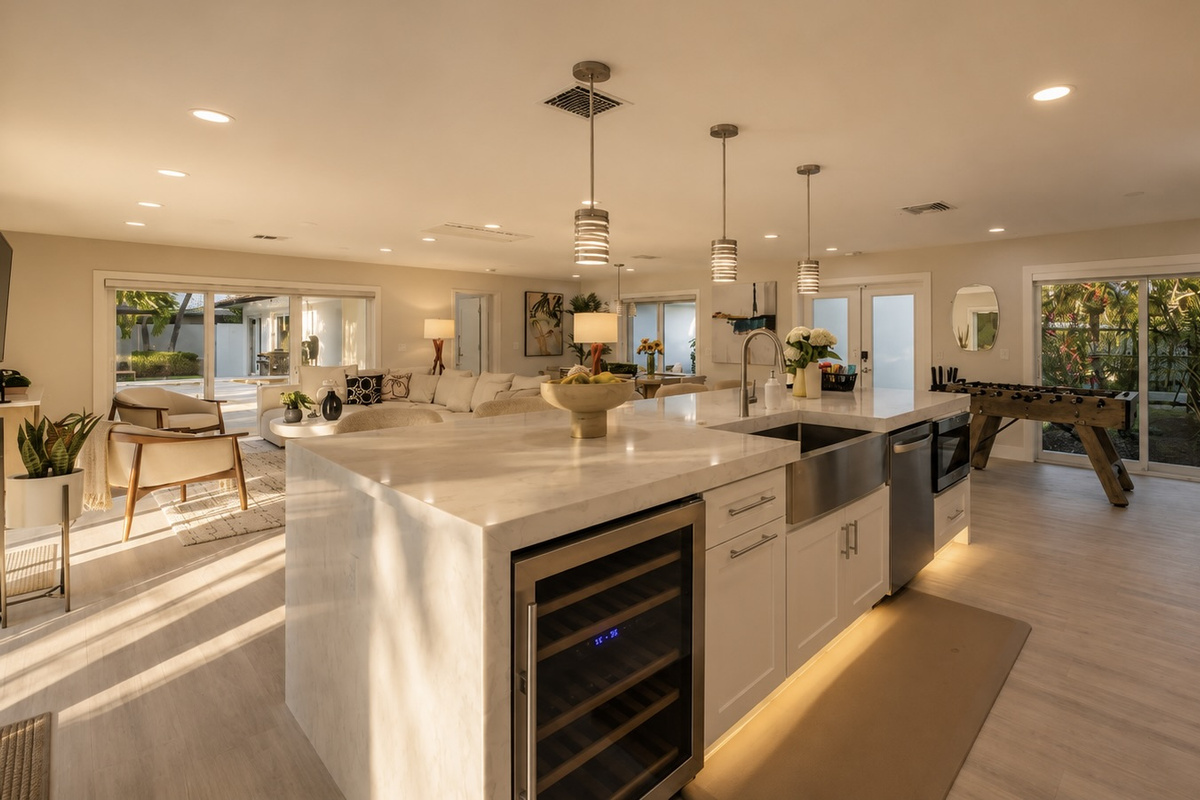 Cook, gather, pour a drink, and unwind in an open kitchen and living area with bar seating, foosball, and plenty of natural light.