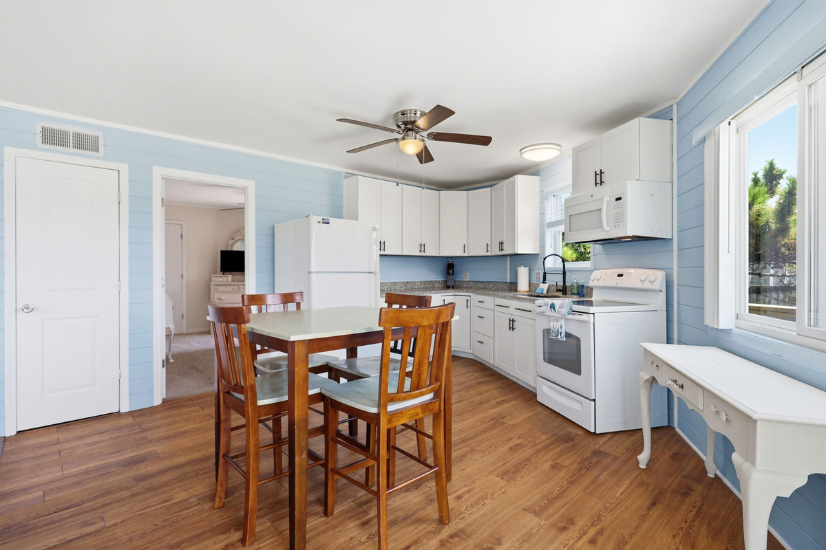 Bright dining space with convenient access to the outdoor deck