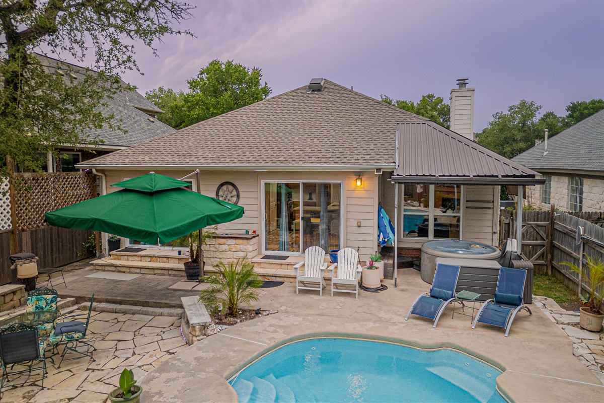 Welcome to your own private Backyard Oasis. Spa jets in pool bench seats & separate hot tub. Natural gas grill, oversized hammock for two, heated pool. Could it get any better?! Come, dive in ️