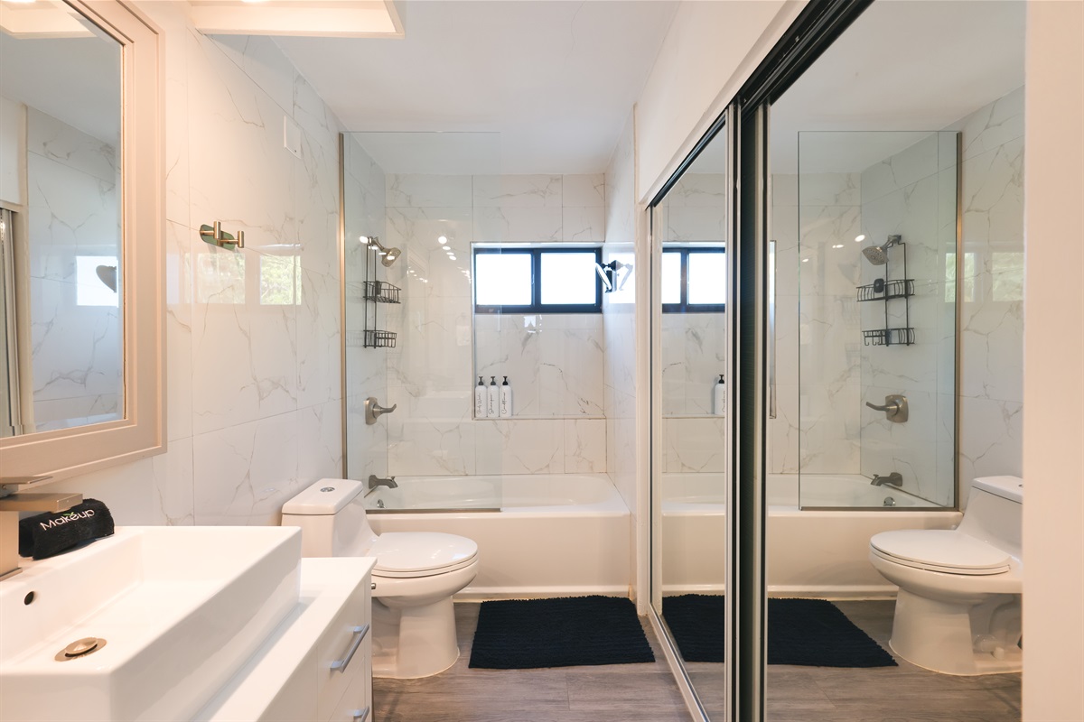 This bathroom is located at the top of the stairs, between the bedrooms.  There is another full bathroom at the bottom of the stairs.