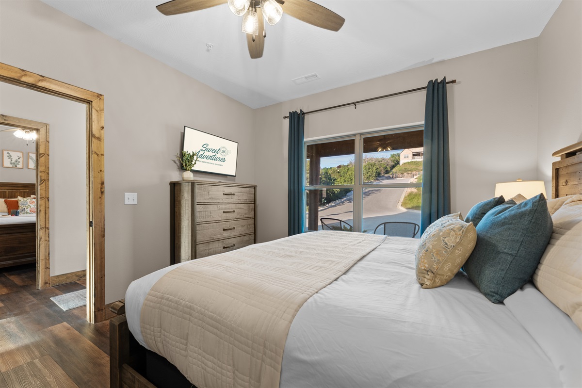 Restful king bedroom with ensuite bath and natural, lake-inspired colors.