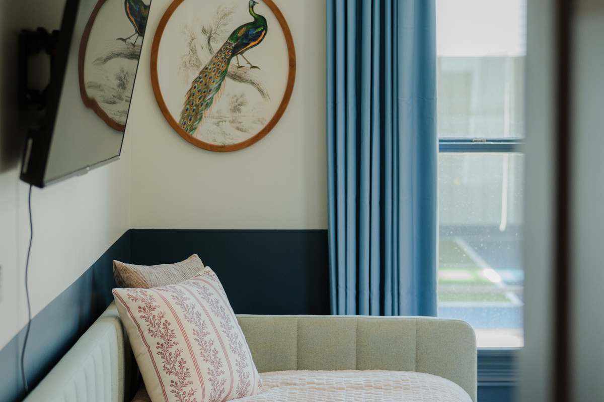 A cozy sleeping nook complete with a twin bed and TV.