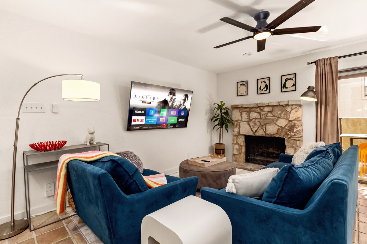 Main living space with comfortable sectional seating and entertainment center.