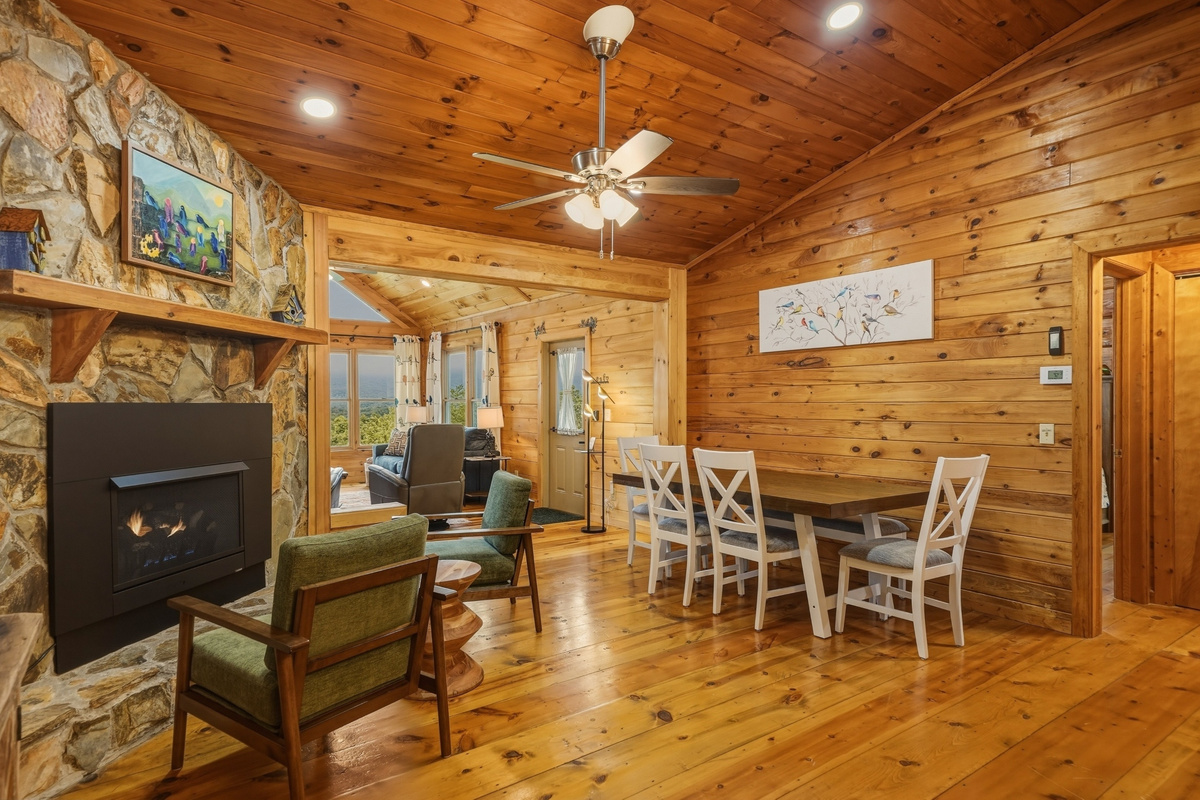 Living area with lots of seating, fire place and smart TV