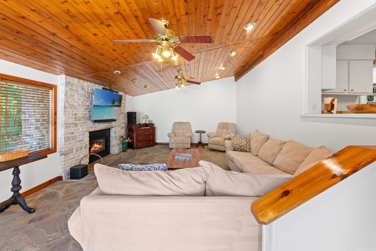 Family room with large TV and outside access