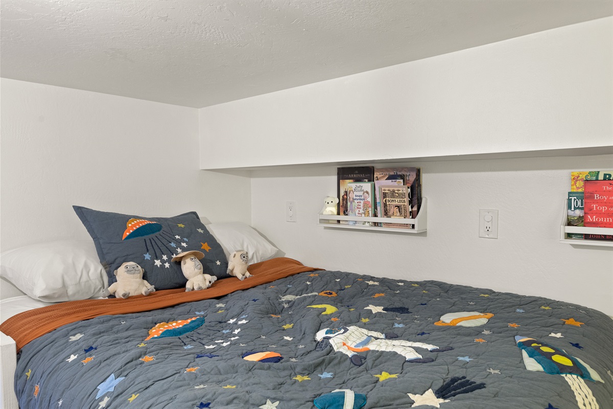 Bedroom 5: Kids will enjoy their space themed private bedroom! If they use a flashlight on the ceiling over the bed, they'll find that there is a glow in the dark galaxy just above their bed.