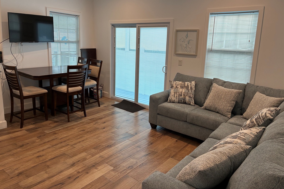 Bright and open kitchen and dining area, perfect for cooking meals and gathering around the table. Enjoy all the comforts of home with plenty of space to dine and relax.