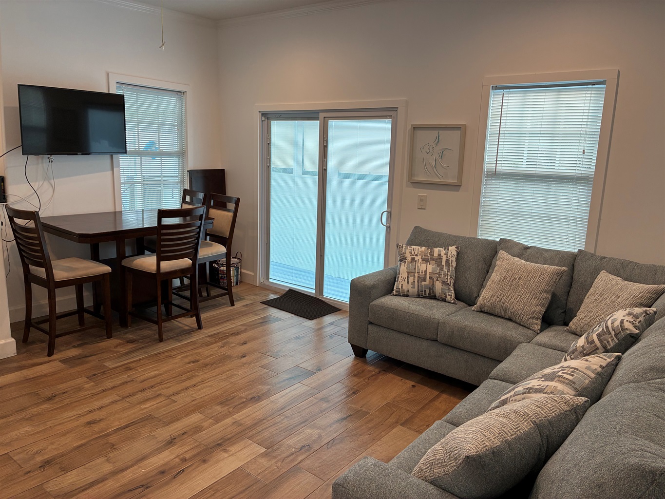 Bright and open kitchen and dining area, perfect for cooking meals and gathering around the table. Enjoy all the comforts of home with plenty of space to dine and relax.