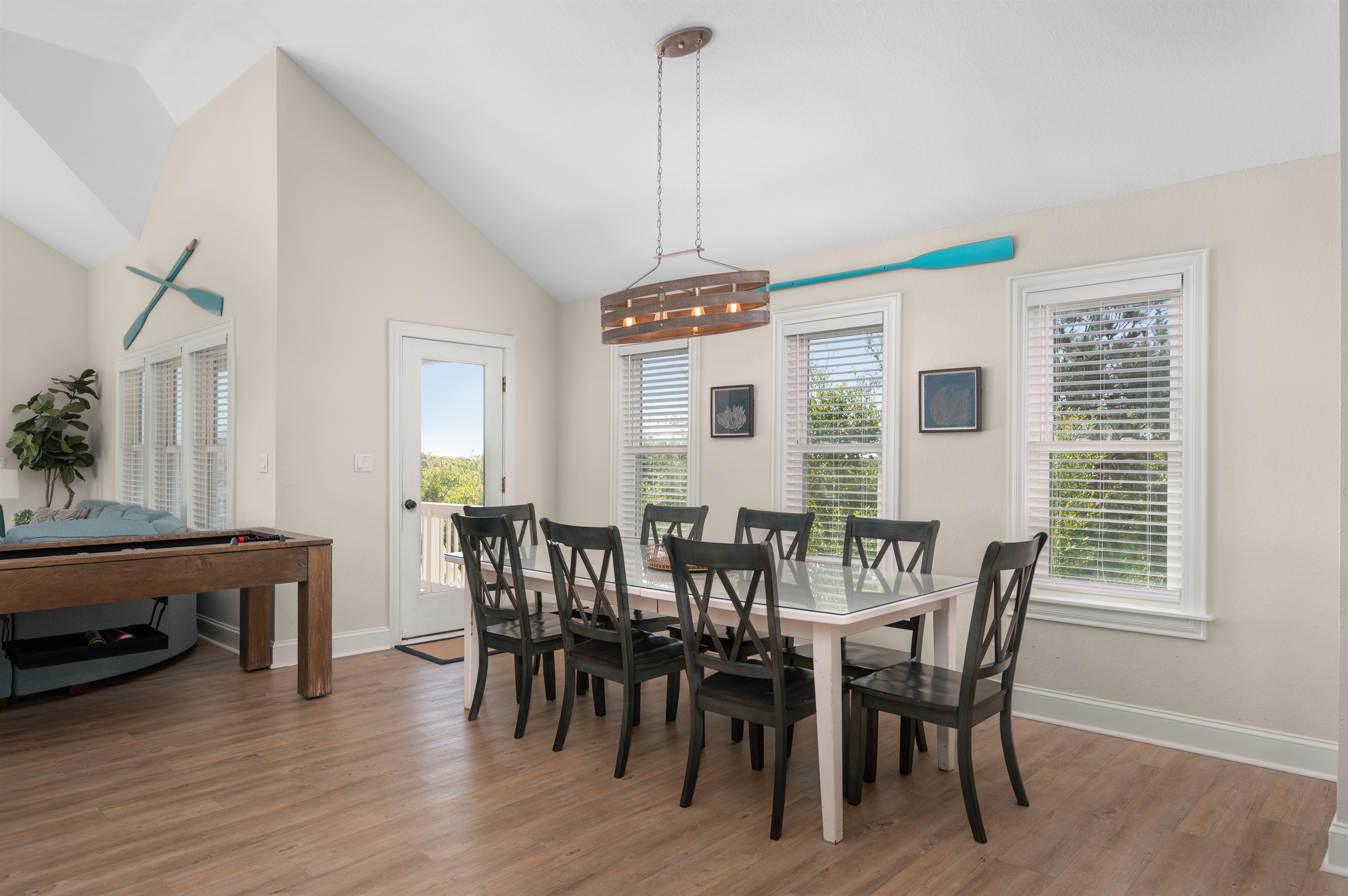 Gather together for meals, games, and vacation memories around the spacious dining table.