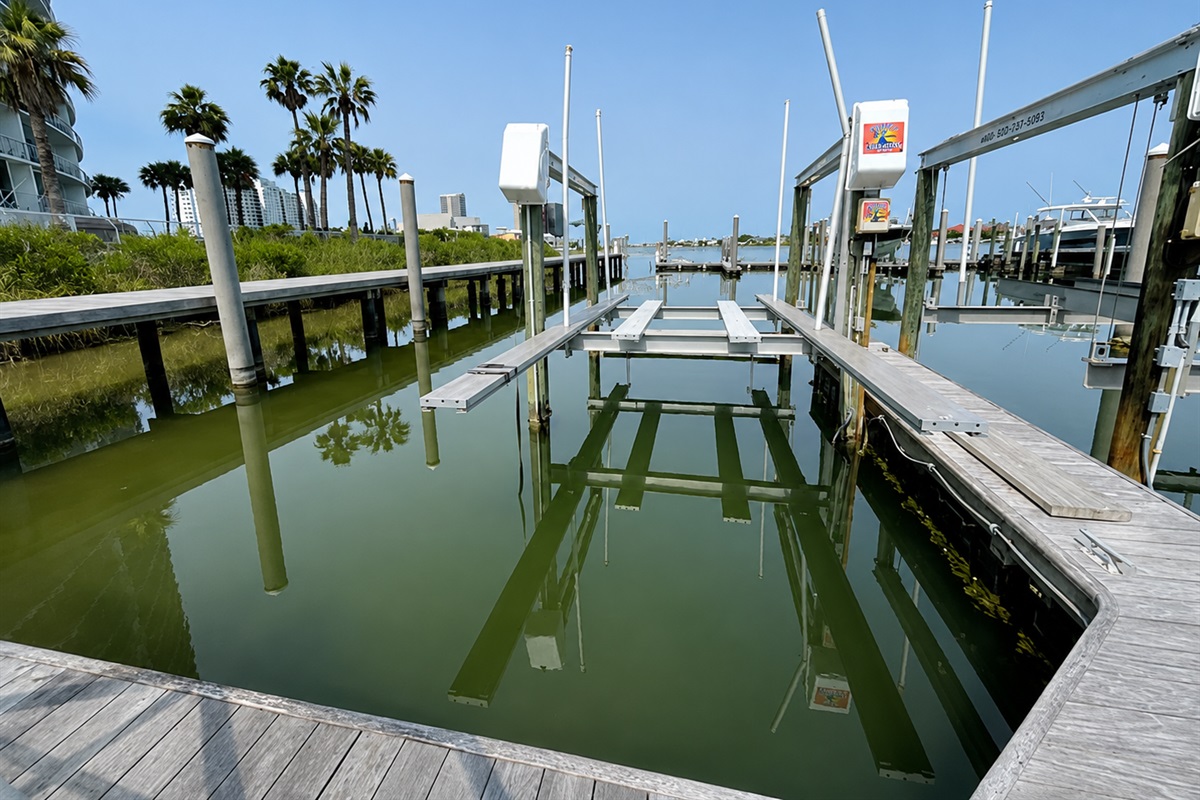 B1 Boat slip comes with rental.  Please see lift picture- Cross beam and slats therefore v-hull boat would not work on lift.  Just Pontoon or Tritoon.  