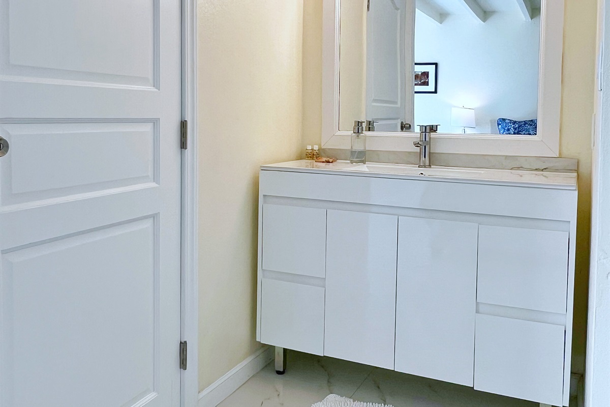 Vanity mirrors and ample storage make getting ready a breeze.