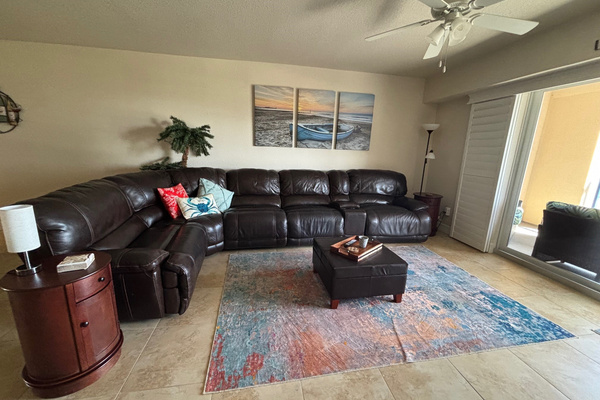Relcining couch, end tables, smart TV.