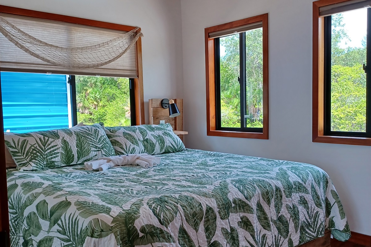 Starfish bedroom with lots of light and king bed