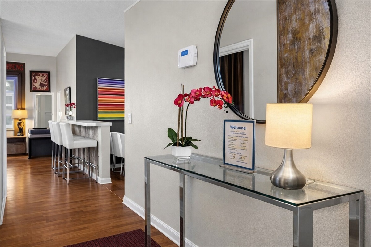 Entryway with modern console table and decorative mirror
