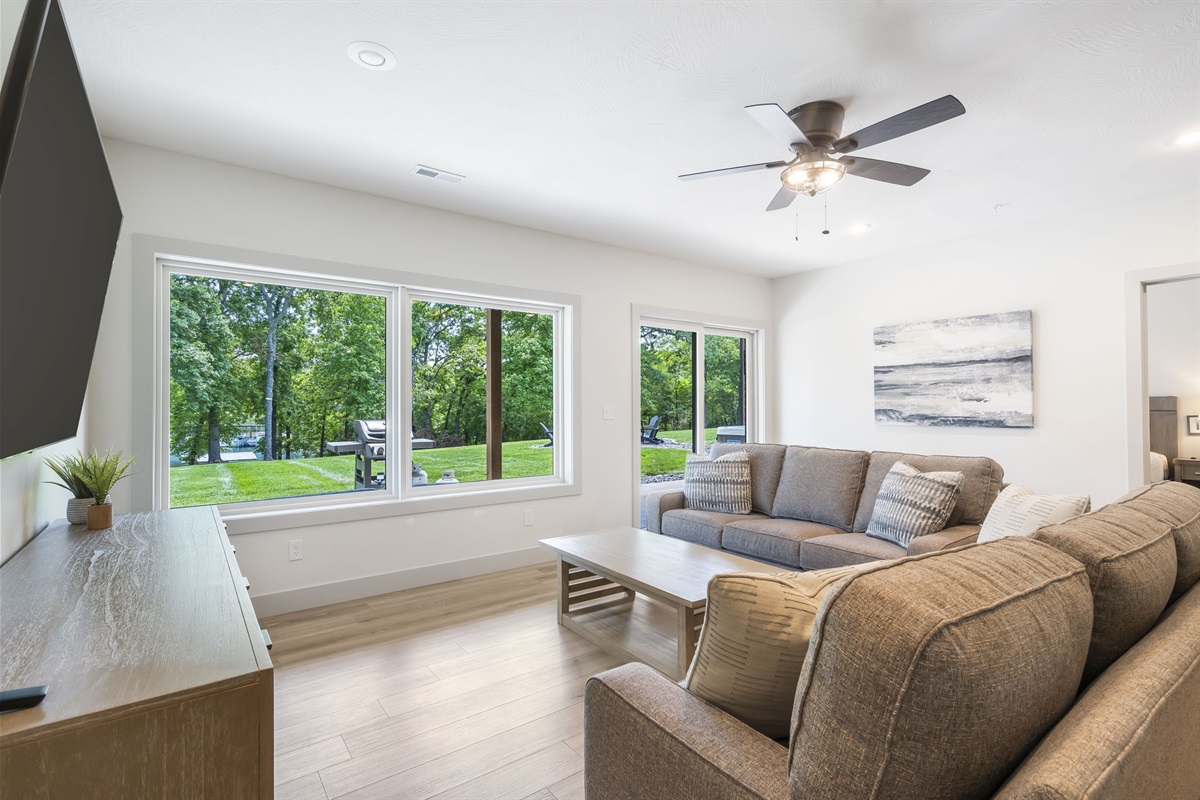 Walkout to the expansive yard, grill, firepits, and private hot tub