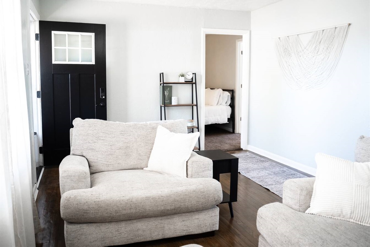 Inviting living room with smart TV and plenty of comfort.